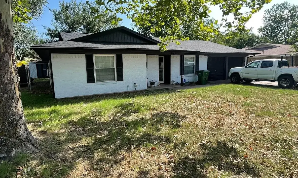 Professional roofing crew working on a residential roof in Lakewood